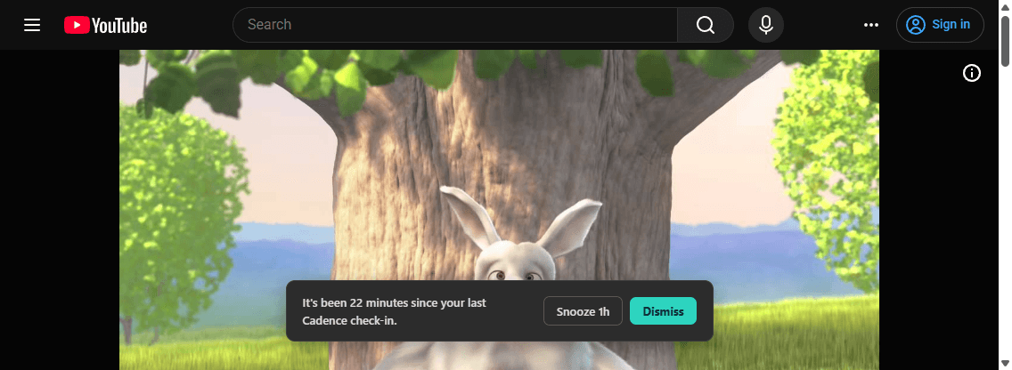A YouTube video paused behind Cadence's on-page note, reading 'It's been 22 minutes since your last Cadence check-in,' with Snooze 1h and Dismiss buttons